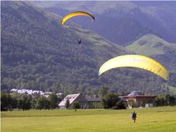 Paragliders landing in the Pyrenees France.